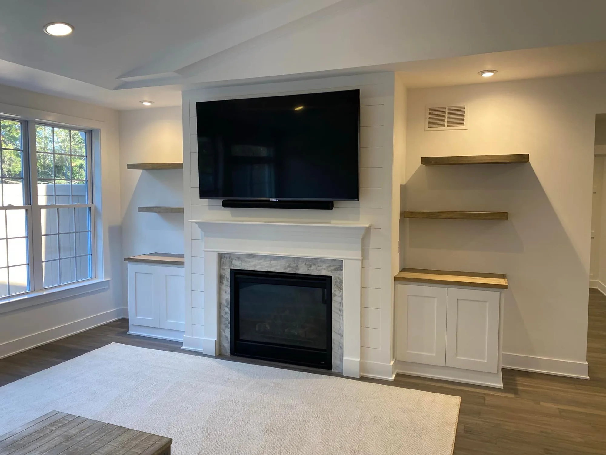 Fireplace Wall with Built-Ins — custom carpentry by Custom Interiors & Remodeling