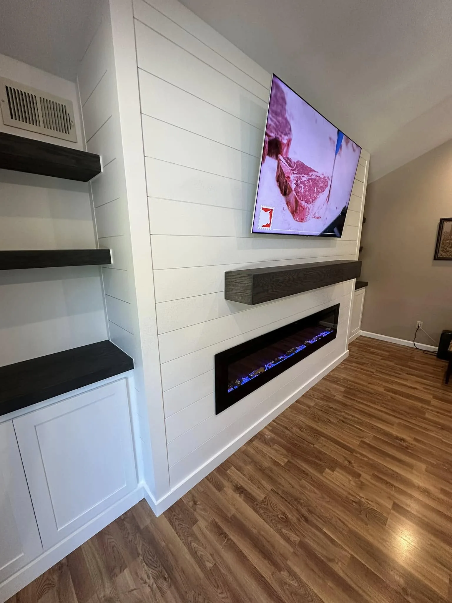Linear Fireplace & Floating Shelves — custom carpentry by Custom Interiors & Remodeling