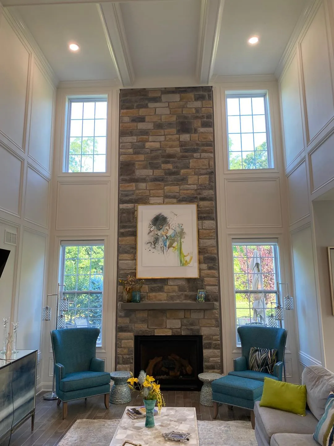 Two-Storey Stone Fireplace — custom carpentry by Custom Interiors & Remodeling